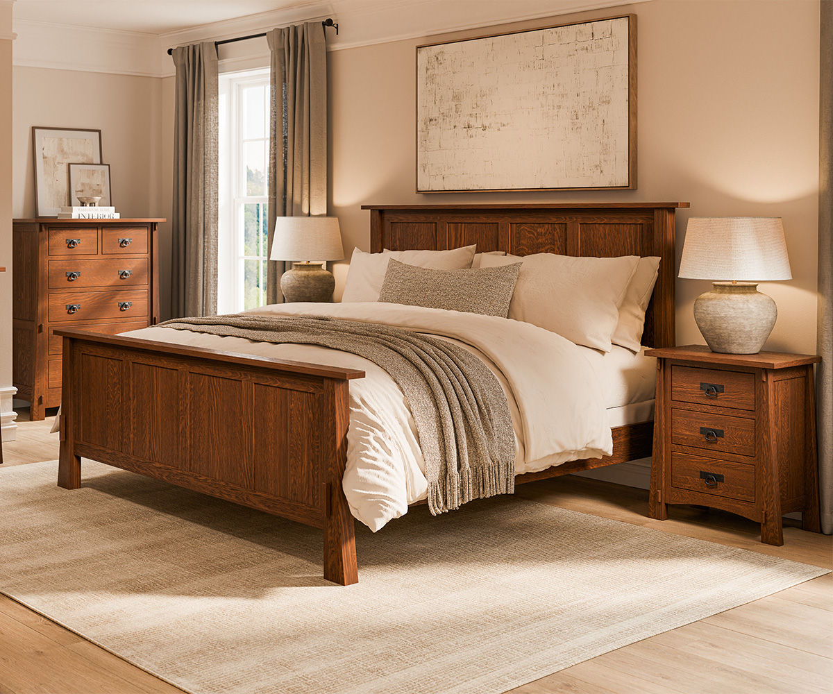 Amish bedroom furniture set with solid wood bed, nightstands, and dresser in soft neutral room.